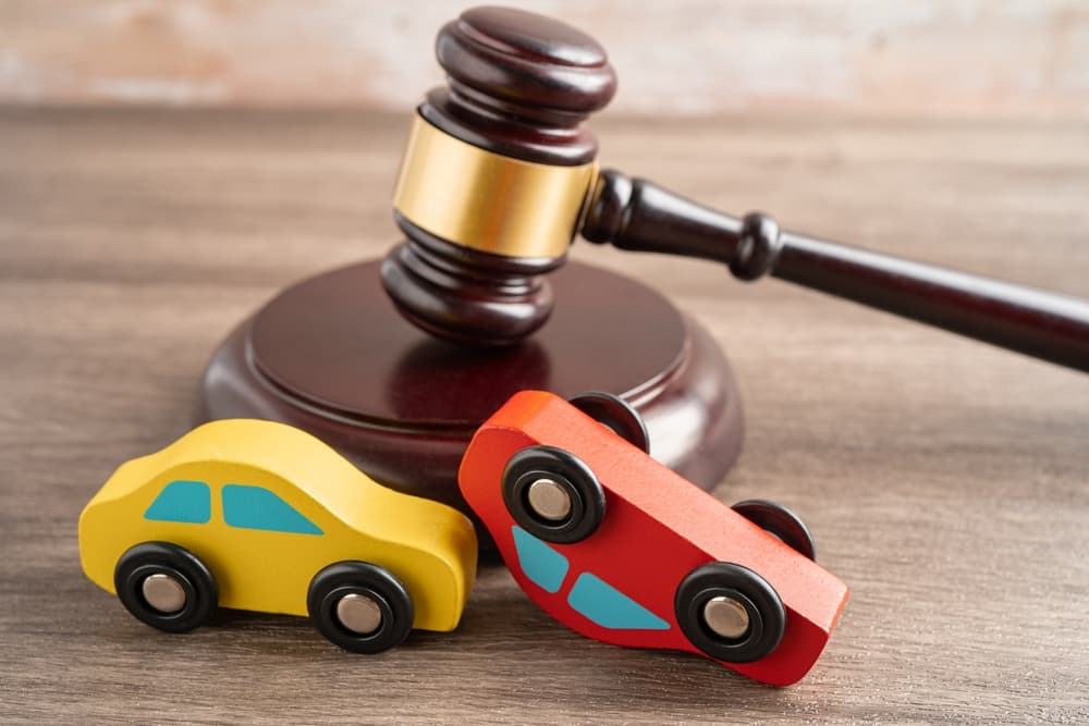 Hammer gavel judge with car vehicle accident