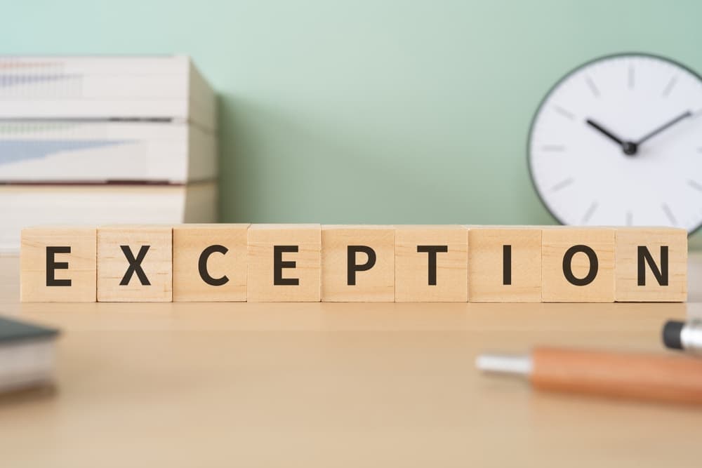 Wooden blocks with "EXCEPTION" text